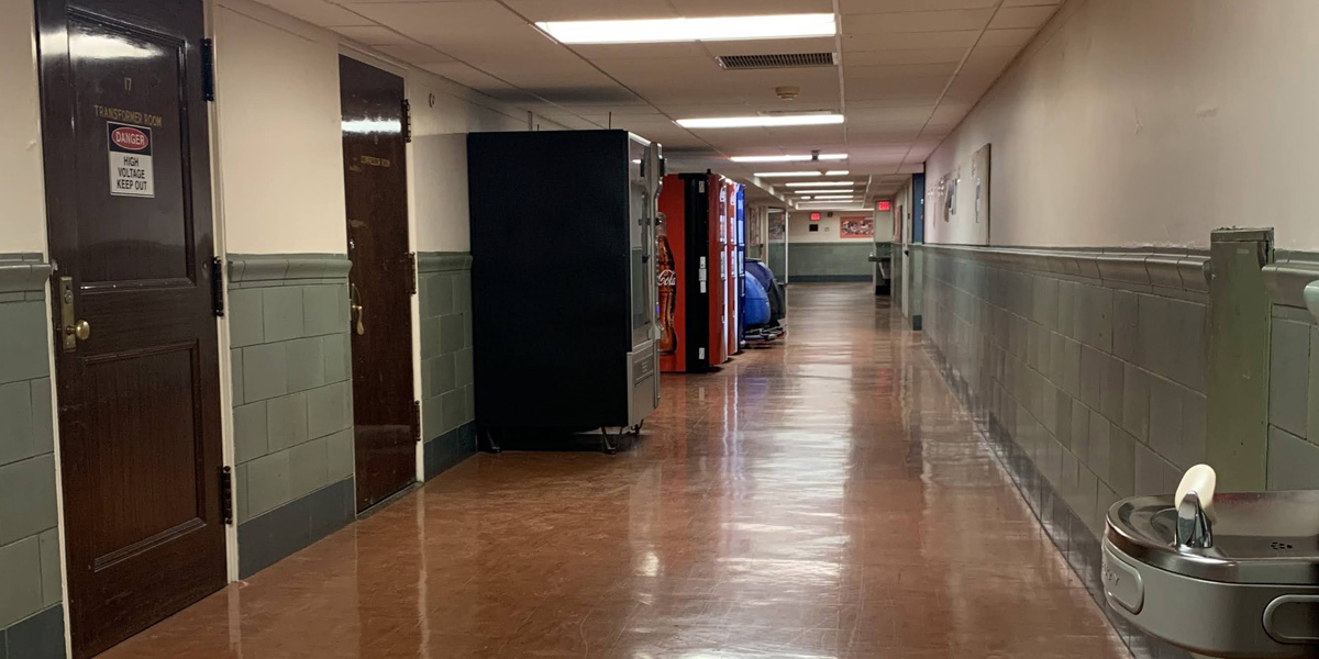 Gregory Hall lower level corridor before from east