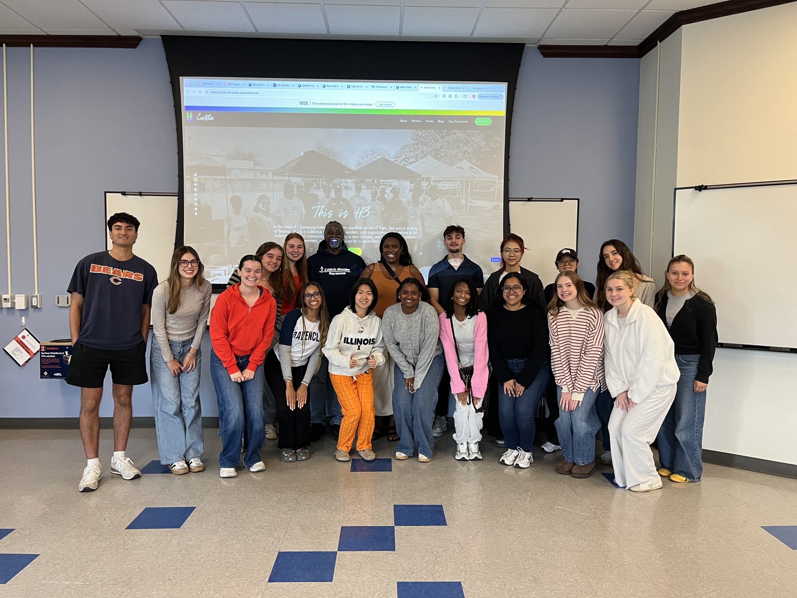 Advertising students pictured with their client, H3.